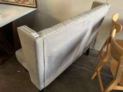 MODERN UPHOLSTERED BOOTH SEATING APROX 46"x25"x39" WITH METAL BUTTON ACCENT AND BLACK WOODEN LEGS