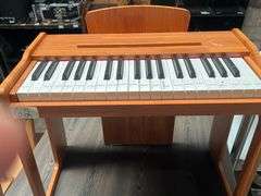 KIDS BATTERY OPERATED WOODEN MINI PIANO WITH NOTE GUIDES ON EACH KEY APROX 22"x1'x19"