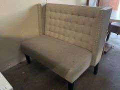 MODERN UPHOLSTERED BOOTH SEATING APROX 46"x25"x39" WITH METAL BUTTON ACCENT AND BLACK WOODEN LEGS