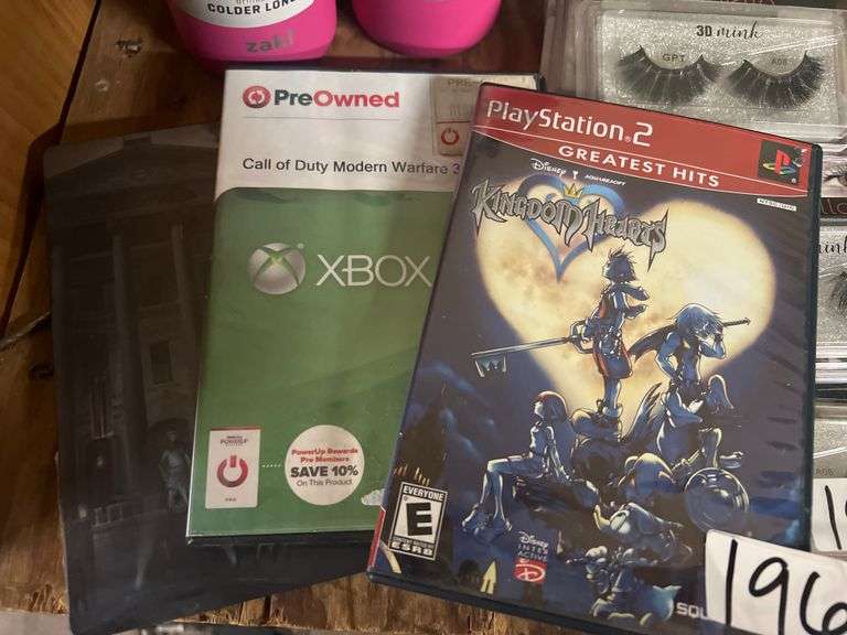 VIDEO GAMES INCLUDING PLAYSTATION 2 KINGDOM HEARTS , XBOX 360 COD MW3 , AND XBOX ONE THIEF IN METAL CASE