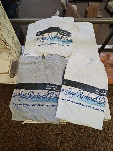 COTTON/POLY BLEND GRAPHIC TEE'S FOR WOMEN IN A VARIETY OF SIZES AND 3-SHOWN COLORS APROX 100 IN BOX