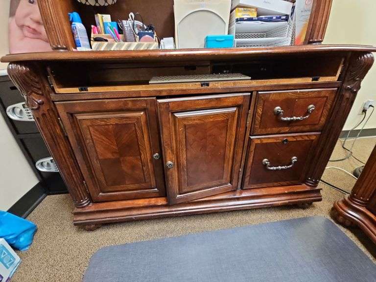 SOLID CHERRY WOOD ARMOIRE WITH BEAUTIFUL CARVED DESIGNS, 2-DRAWERS, BOTTOM CABINET WITH PULL OUT SHELVES APROX 4'x2'x7' MATCHES LOT 29 , 30, & 35