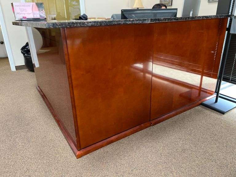 BEAUTIFUL CUSTOM GRANITE TOPPED SOLID CHERRY WOOD RECEPTIONIST DESK… APROX 6'x6.5'x3.5' **Important Buyer Notice.. Solid Granite top slab piece, cannot be disassembled without damaging unit, bring 4-wheel dollies and plenty of friends! Multiple bay doors that are dock height, as well as ramp