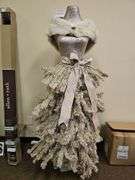 CUSTOM MADE GOLD CHRISTMAS TREE WITH GOLD MANNEQUIN TOP APROX 5'H WITH STAND INCLD.