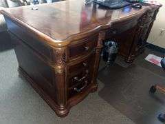 SOLID CHERRY WOOD EXECUTIVE DESK WITH BEAUTIFUL CARVED DESIGNS, 4-DRAWERS AND CABINET WITH PULL OUT SHELVES APROX 6'x3'x32" MATCHES LOT 30, 34 & 35