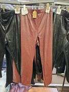 WOMEN'S NEW LEATHER PANTS IN BLACK AND MAROON IN VARIOUS SIZES ORIGINAL RETAIL $50 EA