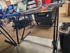 GLASS TOPPED METAL L-SHAPED OFFICE DESK WITH SINGLE SHELF, APROX 4'x4'x3' **Need tools for disassembly