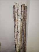 RAW WOOD DÉCOR STICKS AND LARGE FAUX FOLIAGE WITH WHITE FLOWER