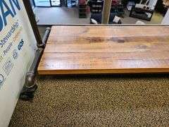 RUSTIC CUSTOM MADE ROLLING CLOTHING RACK WITH METAL PIPE SUPPORTS AND SOLID WOOD SHELVES APROX 40"x16"x68"