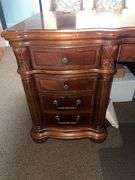SOLID CHERRY WOOD EXECUTIVE DESK WITH BEAUTIFUL CARVED DESIGNS, 4-DRAWERS AND CABINET WITH PULL OUT SHELVES APROX 6'x3'x32" MATCHES LOT 30, 34 & 35