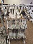 ROLLING METAL 4-TIER HANGER ORGANIZER WITH BRAKES, ADJUSTABLE HEIGHTS APROX 22"x15"x51"  **APROX 100 TOP AND BOTTOM BAMBOO HANGERS INCLD. IN LOT