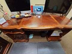 SOLID CHERRY WOOD EXECUTIVE DESK WITH BEAUTIFUL CARVED DESIGNS, 4-DRAWERS AND CABINET WITH PULL OUT SHELVES APROX 6'x3'x32" MATCHES LOT 29 , 30, & 35