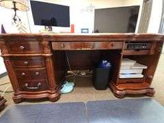 SOLID CHERRY WOOD EXECUTIVE DESK WITH BEAUTIFUL CARVED DESIGNS, 4-DRAWERS AND CABINET WITH PULL OUT SHELVES APROX 6'x3'x32" MATCHES LOT 29 , 30, & 35