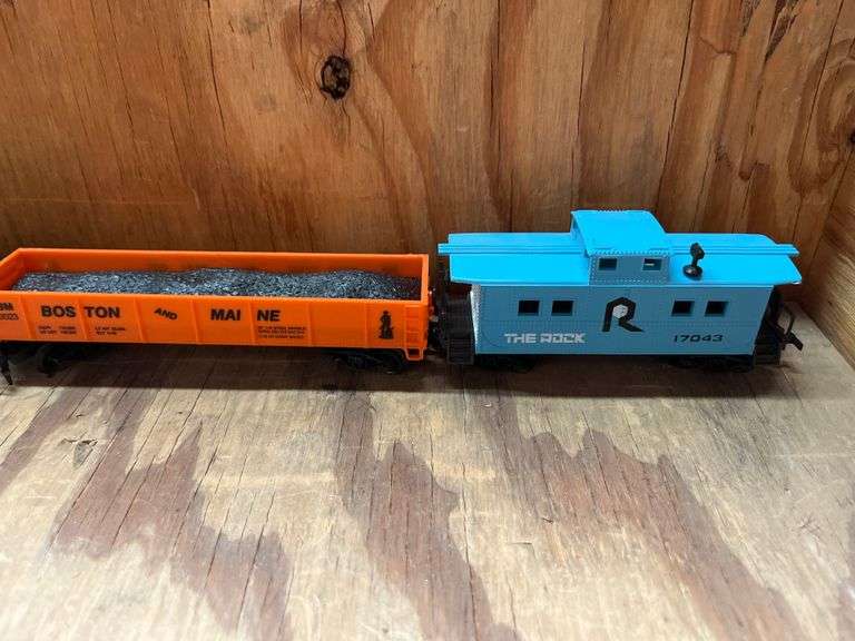 HO Scale train cars incld. "The Rock" (Rock Island) caboose,  Model Power HO Scale (1:87) single-dome tank car, specifically numbered E.O.R.X. 1086