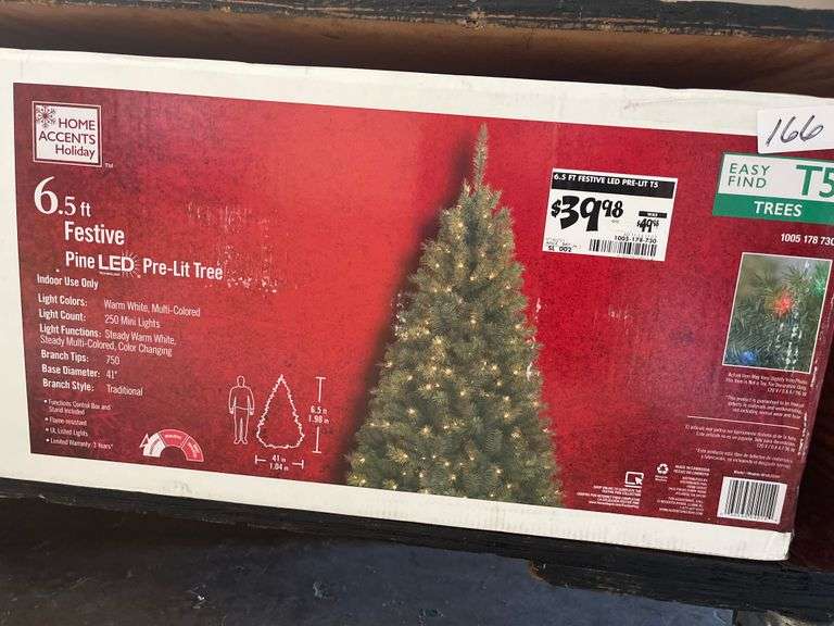Home Accents Holiday 6.5 ft. Festive Pine features 250 pre-lit, color-changing LED mini lights.