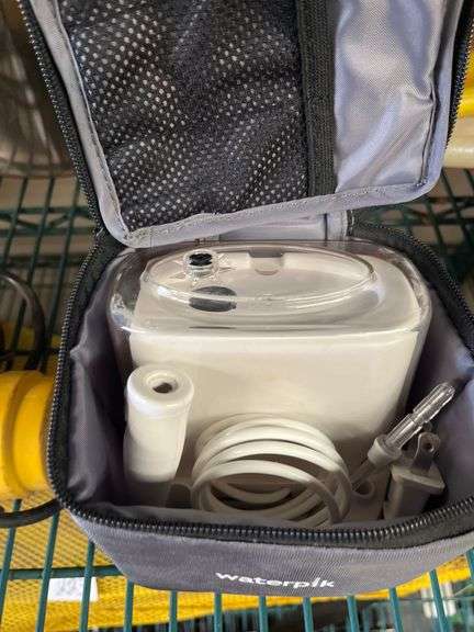 aterpik Sidekick is a portable water flosser