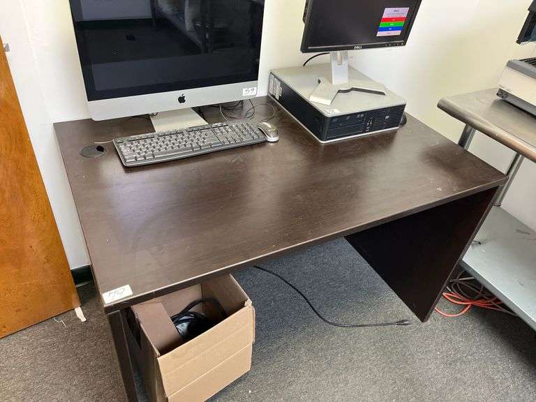 Wood office desk features a sturdy laminate surface and a cable management hole