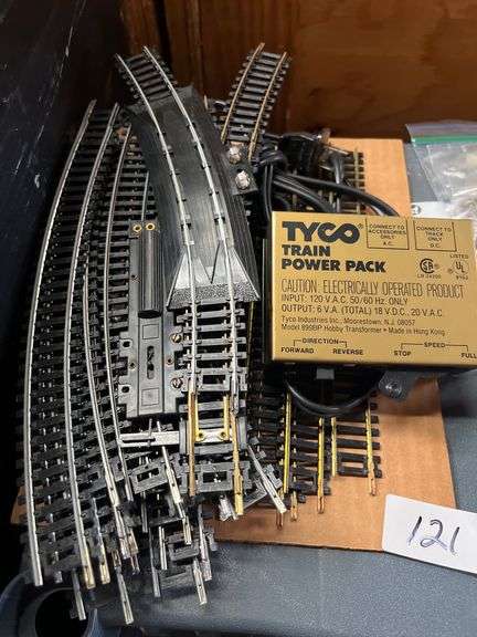 vintage Tyco HO scale model train set featuring brass track, a power pack, and operating instructions. Tyco model 899T