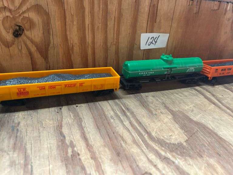 HO Scale train cars incld. "The Rock" (Rock Island) caboose,  Model Power HO Scale (1:87) single-dome tank car, specifically numbered E.O.R.X. 1086