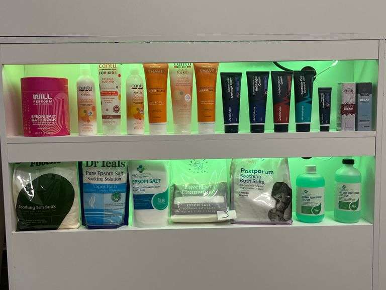 skincare cabinet with various products arranged on two shelves, including creams, lotions, and bath salts. Count 20