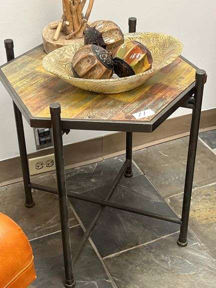 Rustic wood and metal side table with a hexagonal top featuring a weathered wood finish and a dark metal frame