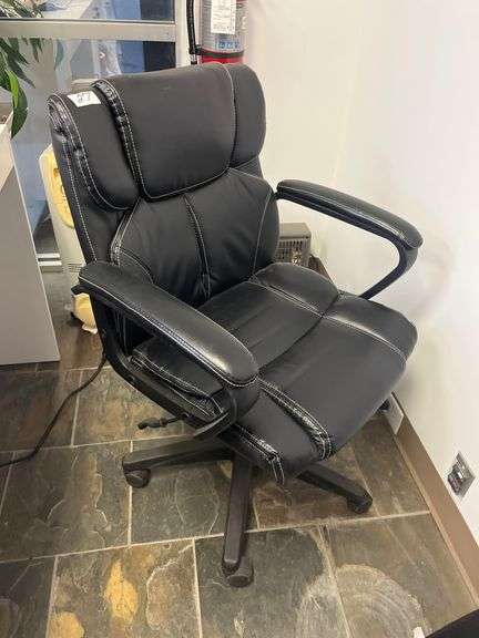Leather High-Back Chair features prominent white stitching