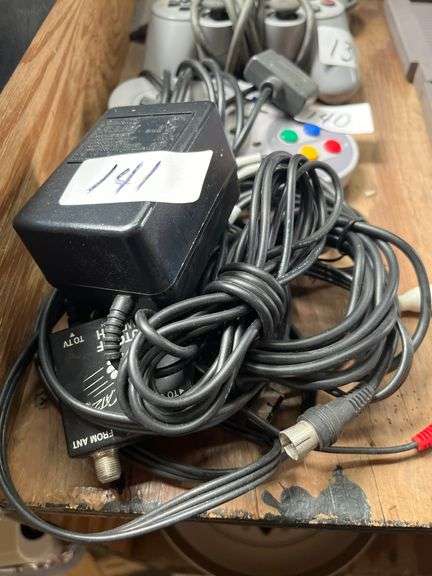 vintage Nintendo Entertainment System (NES) AC adapter, likely model NES-002.