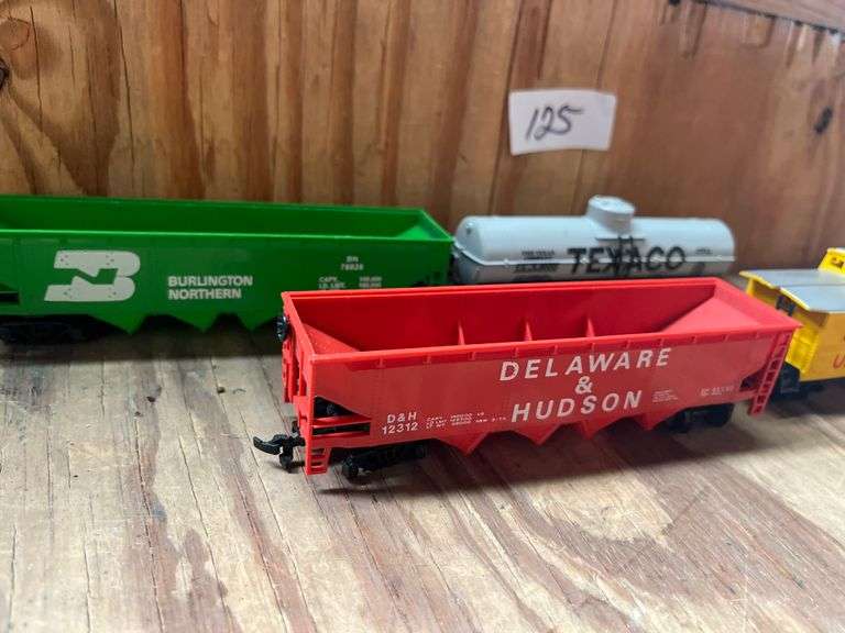 lot includes HO Scale models incld. the Delaware & Hudson hopper car and a Union Pacific caboose.