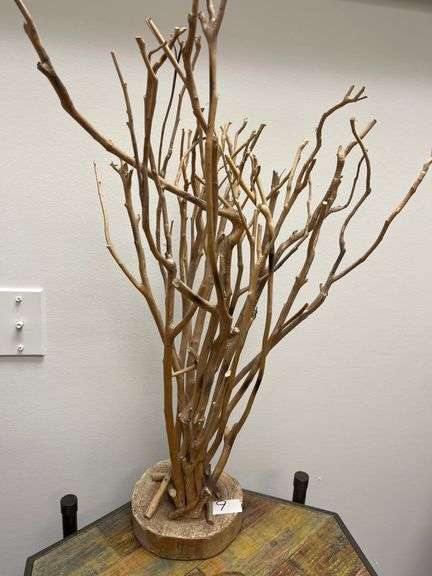Decorative centerpiece natural willow or mulberry wood branches arranged on a solid base