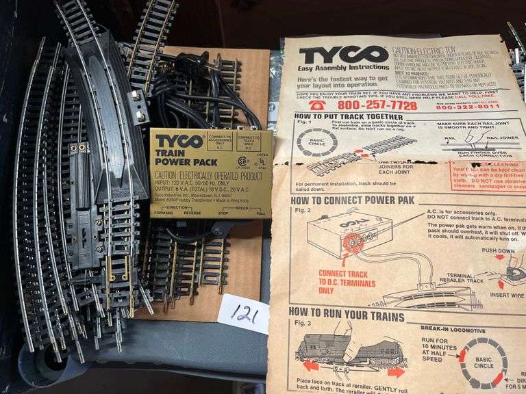 vintage Tyco HO scale model train set featuring brass track, a power pack, and operating instructions. Tyco model 899T