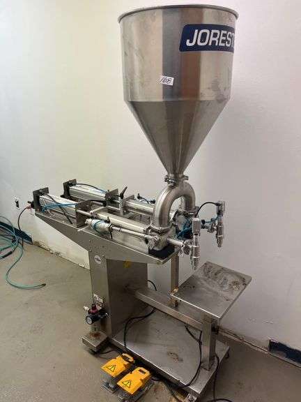 JORESTECH brand dual-head high-viscosity paste piston filling machine, model E-FP-1000-D2. Priced for $10K