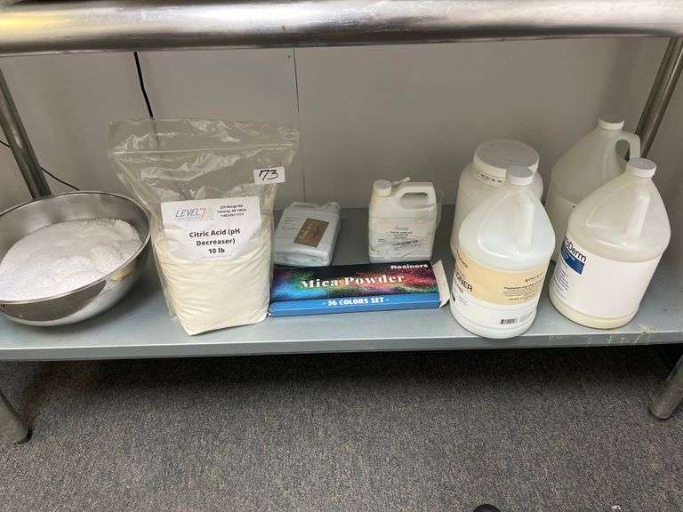 Assorted lot incld. 10 lb bag of Level 7 brand Citric Acid, Ginger Lily Farms Botanicals ZeroDerm Advanced Therapy 1-gallon refill jugs, Resiners brand 36-color mica powder set
