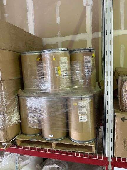 Brown fiber drums filled w/