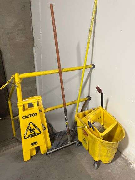 Rubbermaid Commercial Products WaveBrake 35-quart mop bucket w/ caution signs