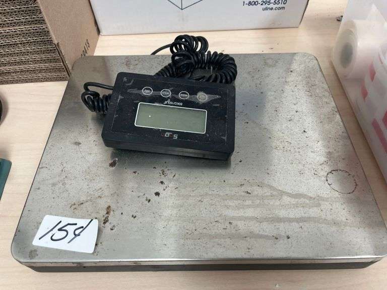 Heavy-duty stainless steel industrial shipping scale with a separate digital display panel.