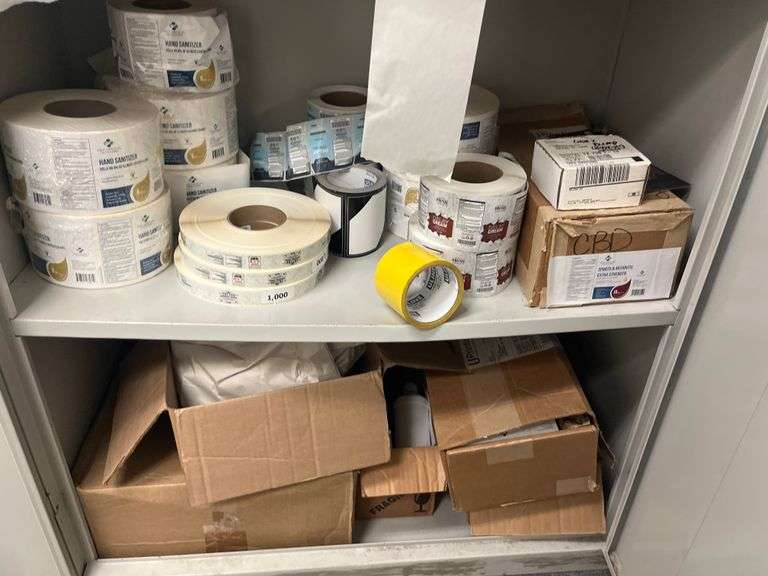 Shelf lot containing DLK Medical Solutions hand sanitizer wipes, rolls of shipping labels