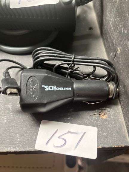 Genuine OEM black 12-volt DC car lighter charger for the Nintendo DS gaming system.