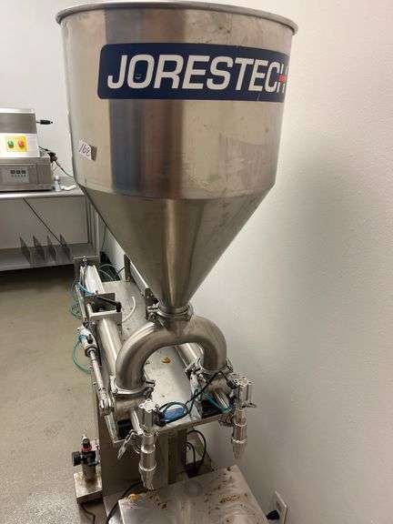 JORESTECH brand dual-head high-viscosity paste piston filling machine, model E-FP-1000-D2. Priced for $10K
