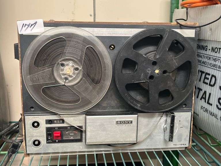 Vintage Sony TC-108A reel-to-reel tape recorder features a wooden casing and twin tape reels
