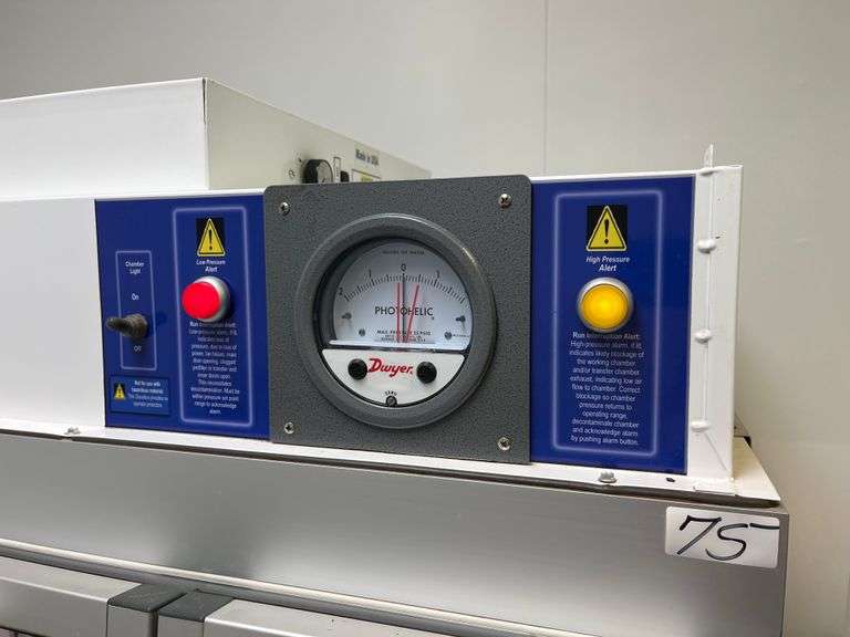 Class III Biosafety Cabinet or a specialized Aseptic Enclosure, Dwyer Photohelic® Pressure Monitor, Glove Ports, Control panel, mobile stand. Retails $8k
