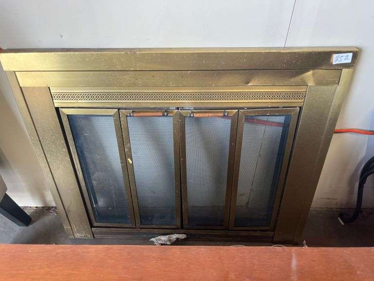 Brass-framed, four-panel glass fireplace screen