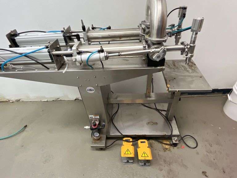 JORESTECH brand dual-head high-viscosity paste piston filling machine, model E-FP-1000-D2. Priced for $10K