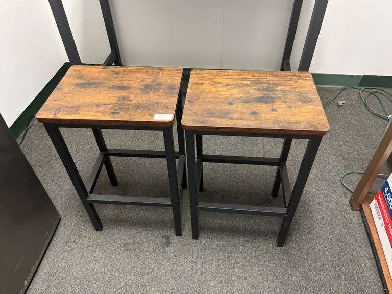 Bar stools feature a rustic brown engineered wood top and a sturdy black metal frame