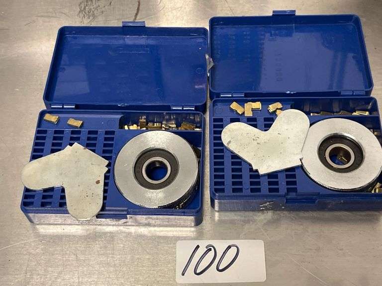 Coining wheel sealing machine, The set includes a circular wheel for embossment, a backing plate, and a variety of small, loose copper letters and numbers