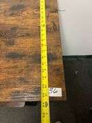 Industrial Bar Table featuring a rustic brown engineered wood top and a black metal frame