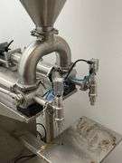 JORESTECH brand dual-head high-viscosity paste piston filling machine, model E-FP-1000-D2. Priced for $10K