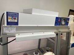 Class III Biosafety Cabinet or a specialized Aseptic Enclosure, Dwyer Photohelic® Pressure Monitor, Glove Ports, Control panel, mobile stand. Retails $8k