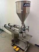 JORESTECH brand dual-head high-viscosity paste piston filling machine, model E-FP-1000-D2. Priced for $10K