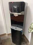 Bottom Loading Hot/Cold/Room Temperature Water Dispenser in a black and stainless steel finish