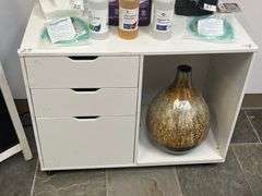 White mobile file cabinet features three storage drawers and an open shelf